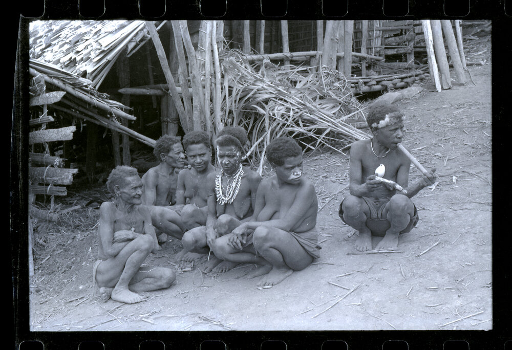 Group of Women Sitting Outside a Building