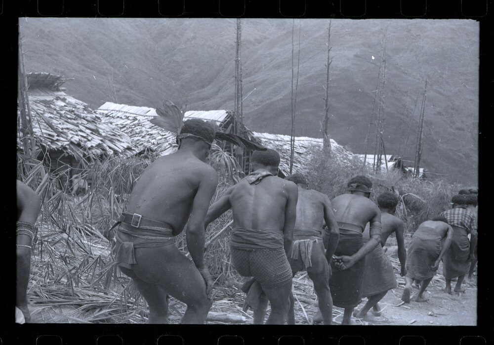 Men Preparing for a Ceremony
