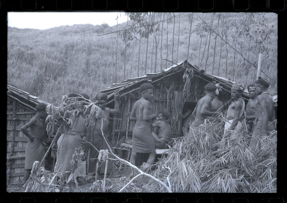 Group of Men Standing Outside a Building