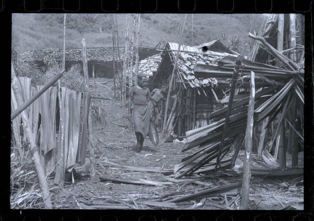 Man Walking Through a Village