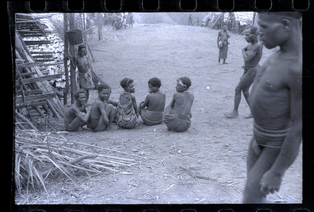 Group of Women Sitting Outside a Building
