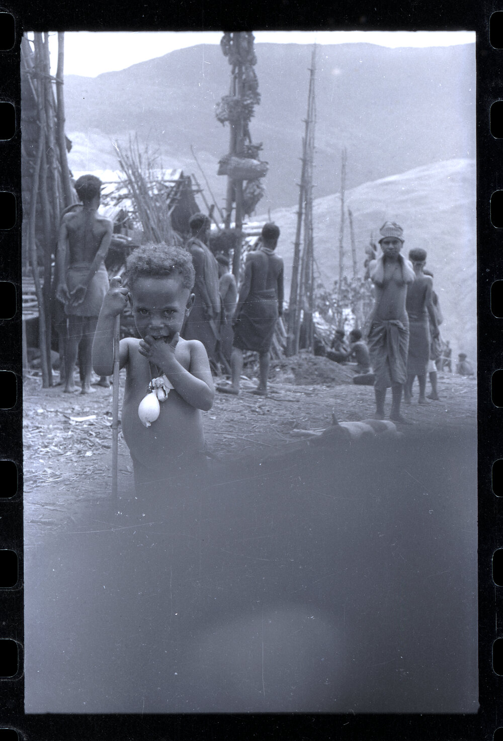 Child Standing in a Village