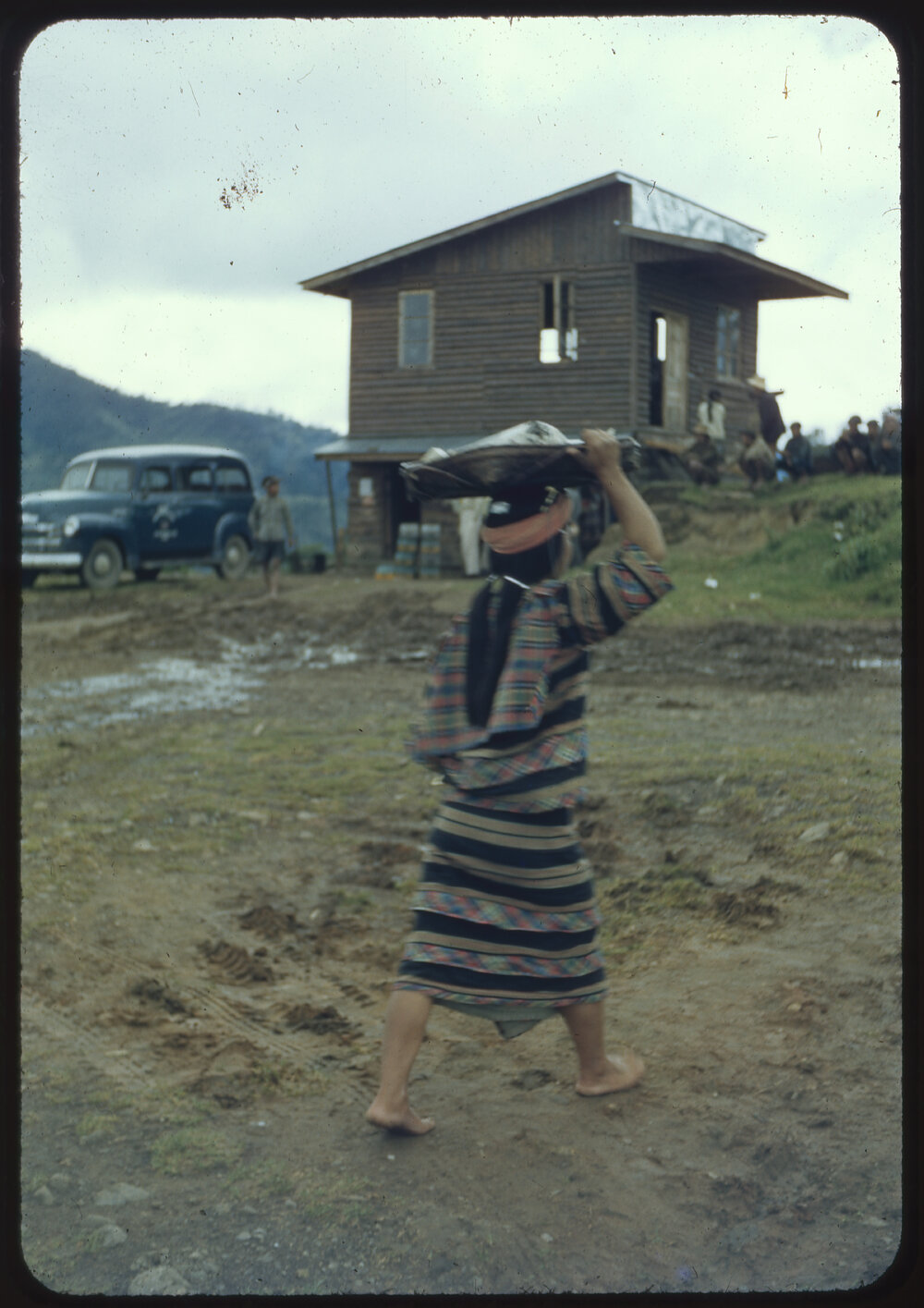 Girl Carrying a Basket on her Head