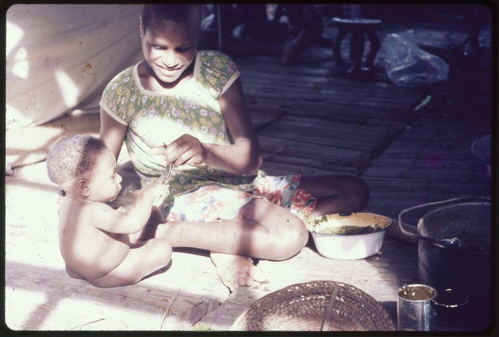 Woman Feeding Baby