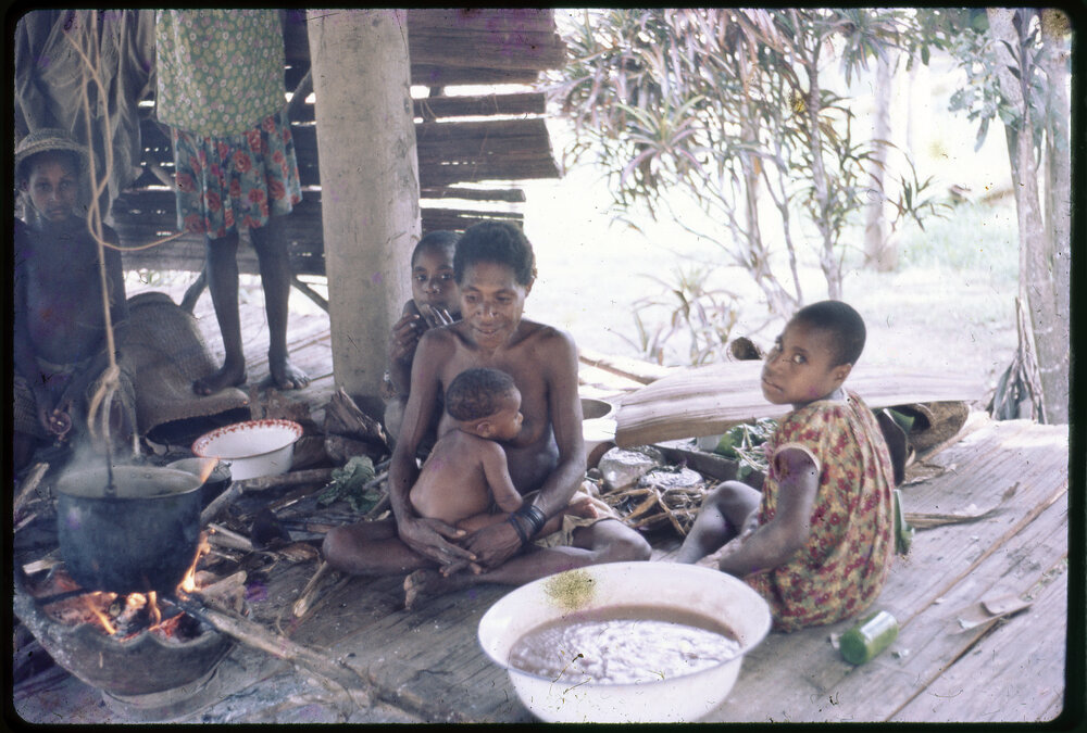 Women and Children Around Cooking Fire