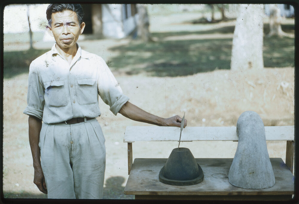 Man Standing Beside Ceramics