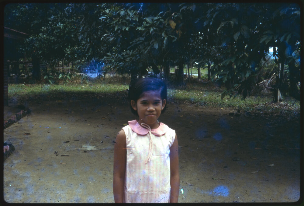 Girl Standing in Garden