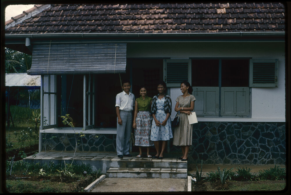 Group Standing Outside a House