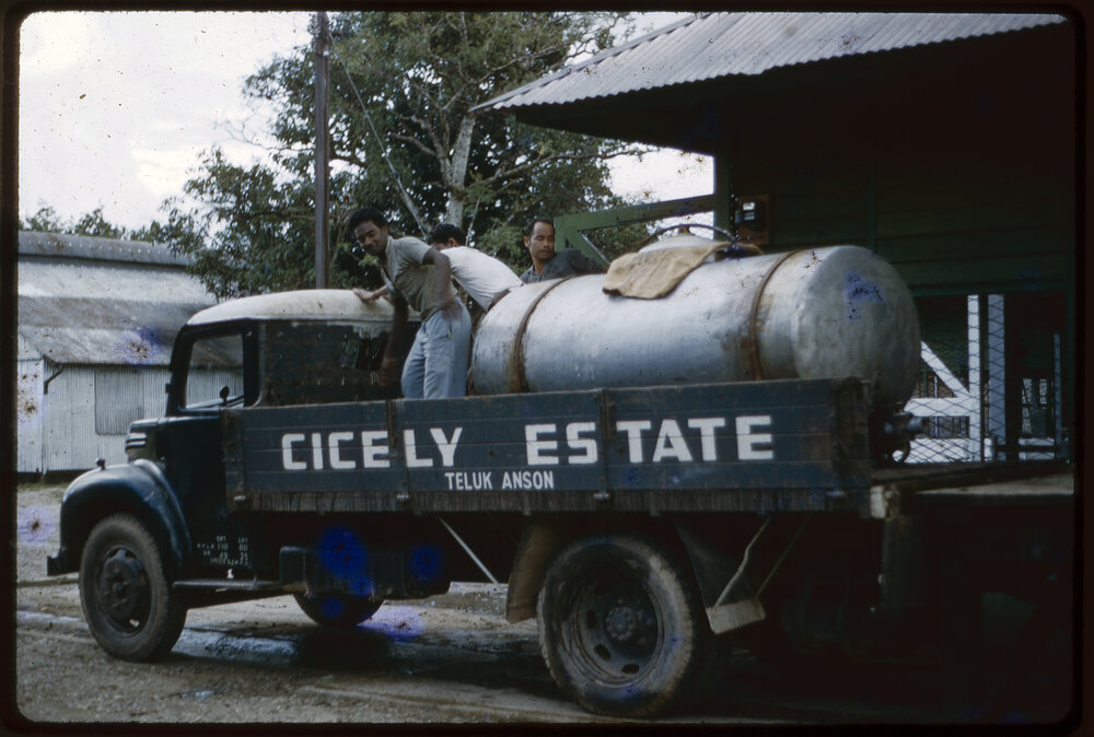 Men Standing on Cicely Estate Truck, Malaysia