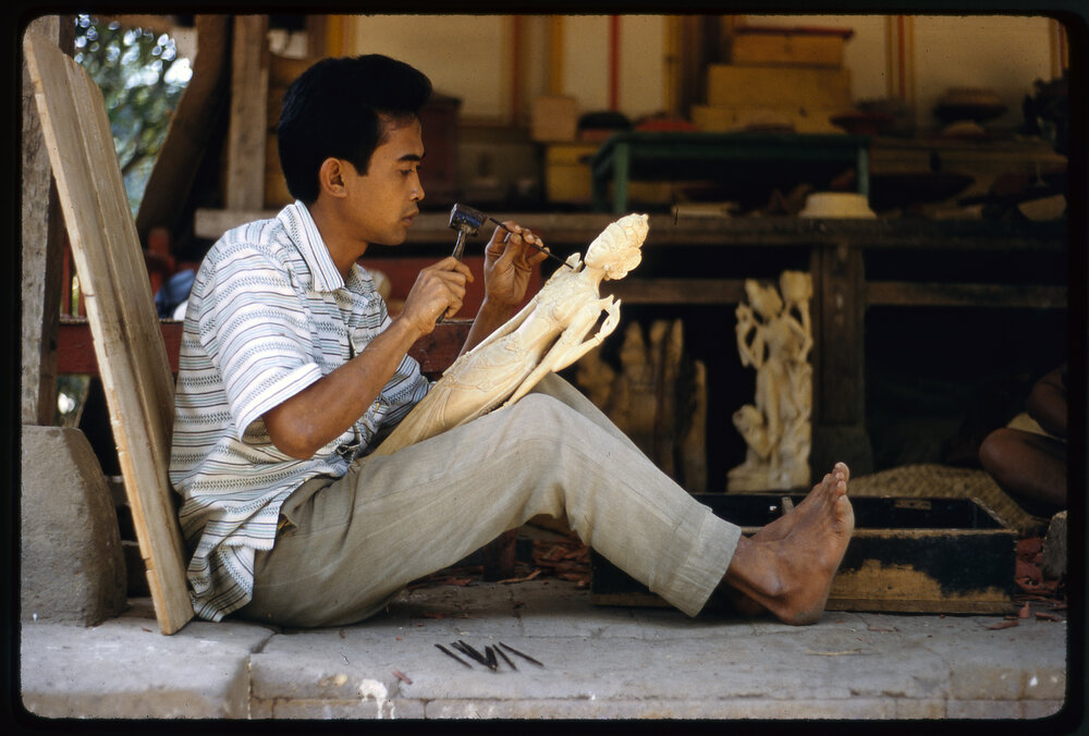 Man Carving Wooden Figure