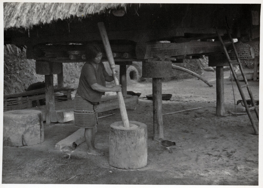 Women by Wooden Structure on Stilts