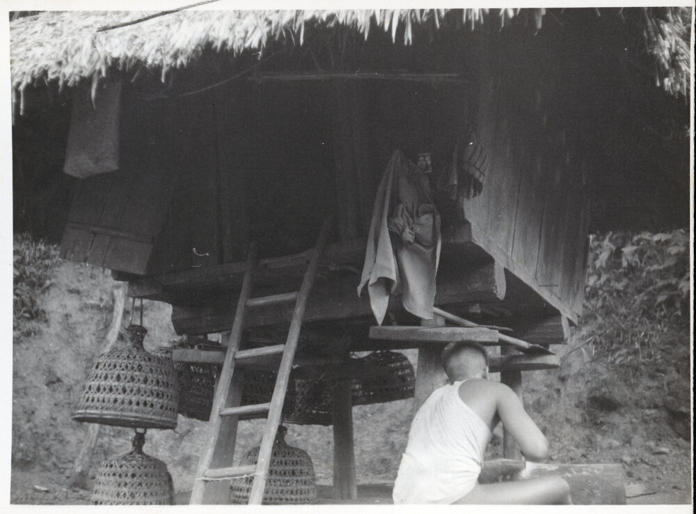 Women by Wooden Structure on Stilts