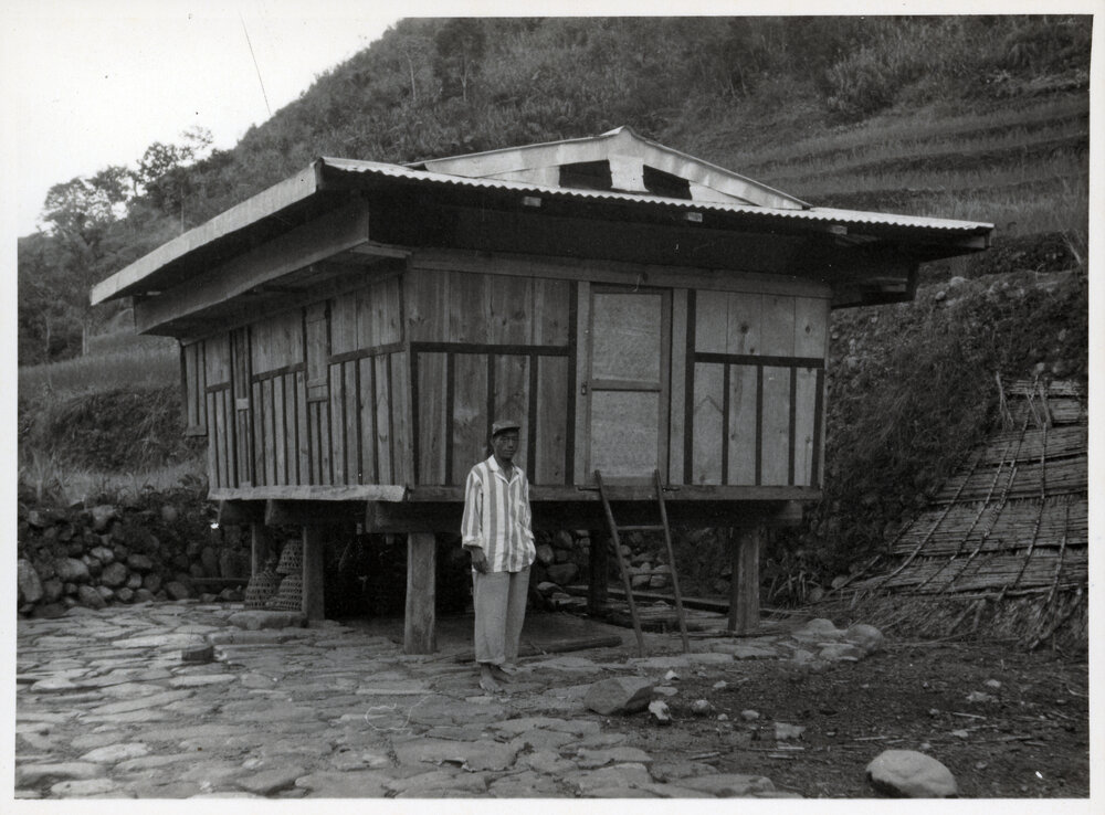 Man Standing by Building