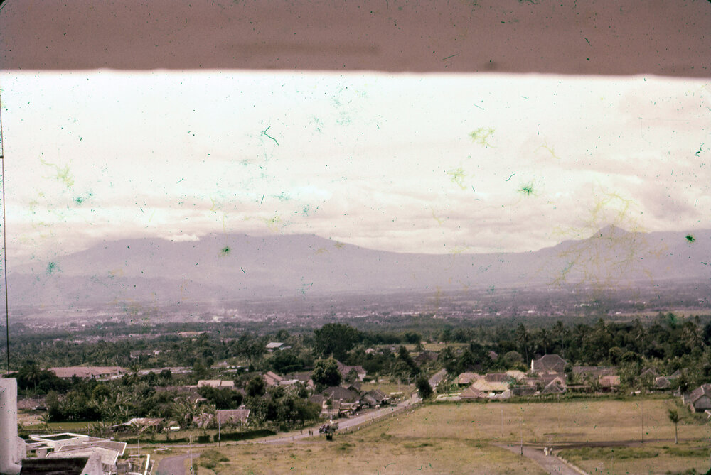 View of Buildings with Mountains in Background