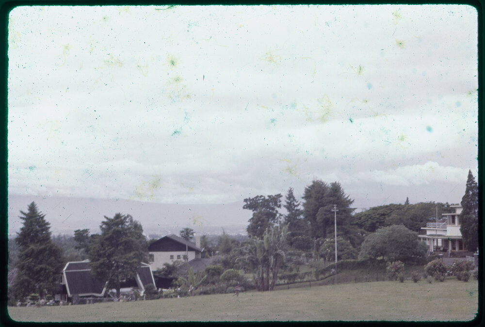 View Across Field with Buildings in Background