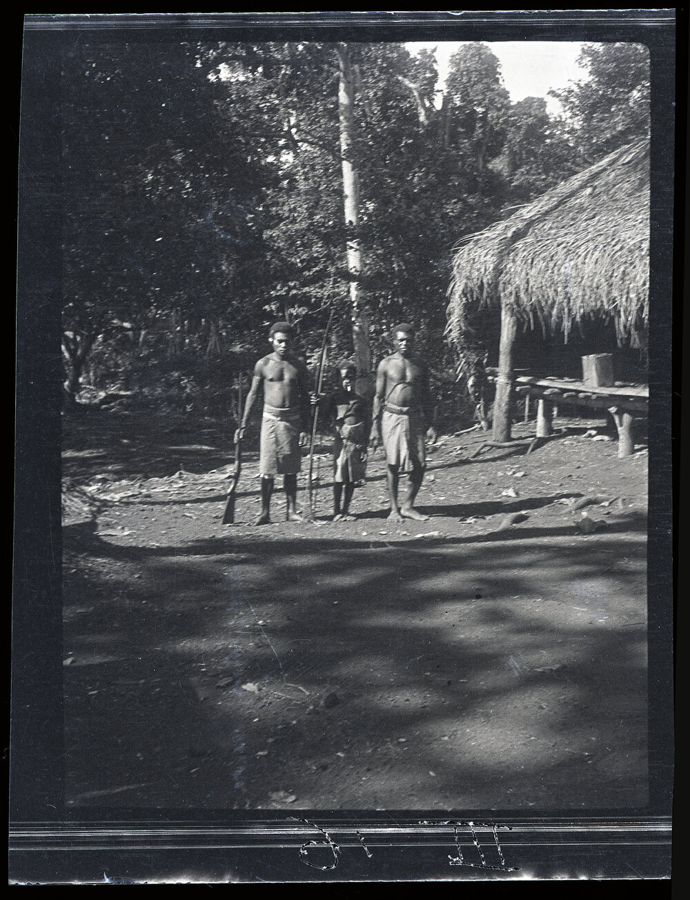 [Manum Island, New Guinea] Joseph, Maswash and Mewo Outside the&rsquo;&rsquo;House Kiap&rdquo; at Tsogari