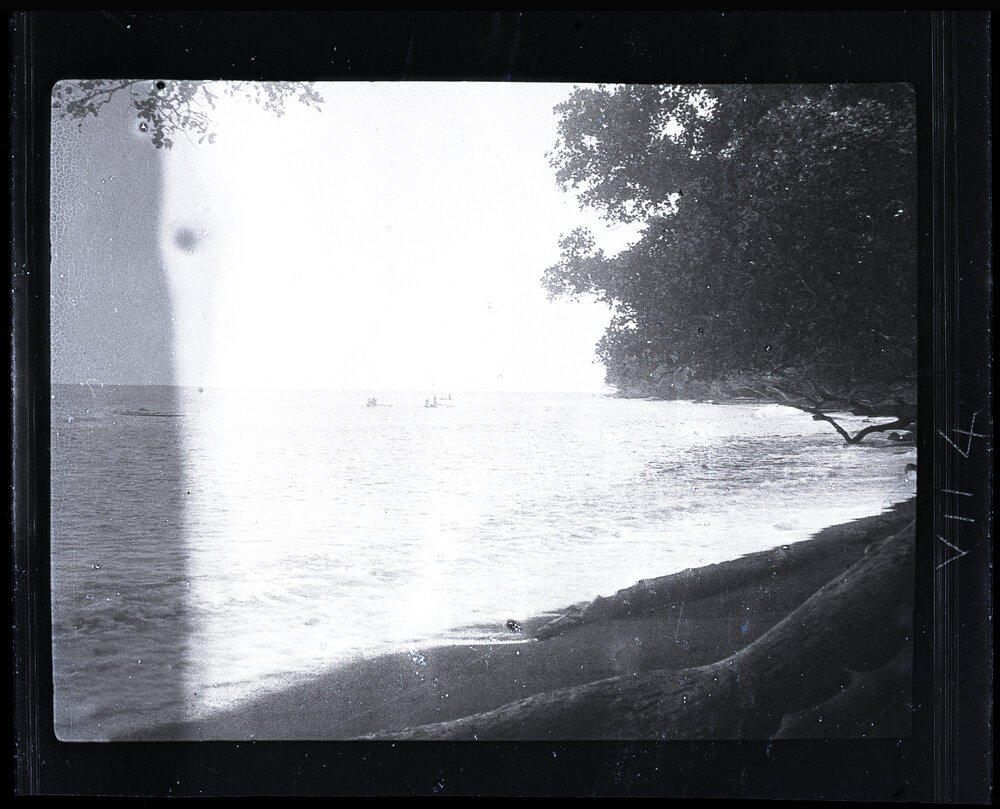 [Manum Island, New Guinea] Canoes Going out to get Crabs Carried by the Flotsam Brought Down from the Mainland Rivers