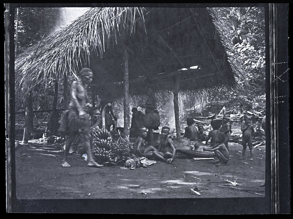 [Manum Island, New Guinea] Women Beginning to Cook; the Vegetable Food in Front of a Half Built House