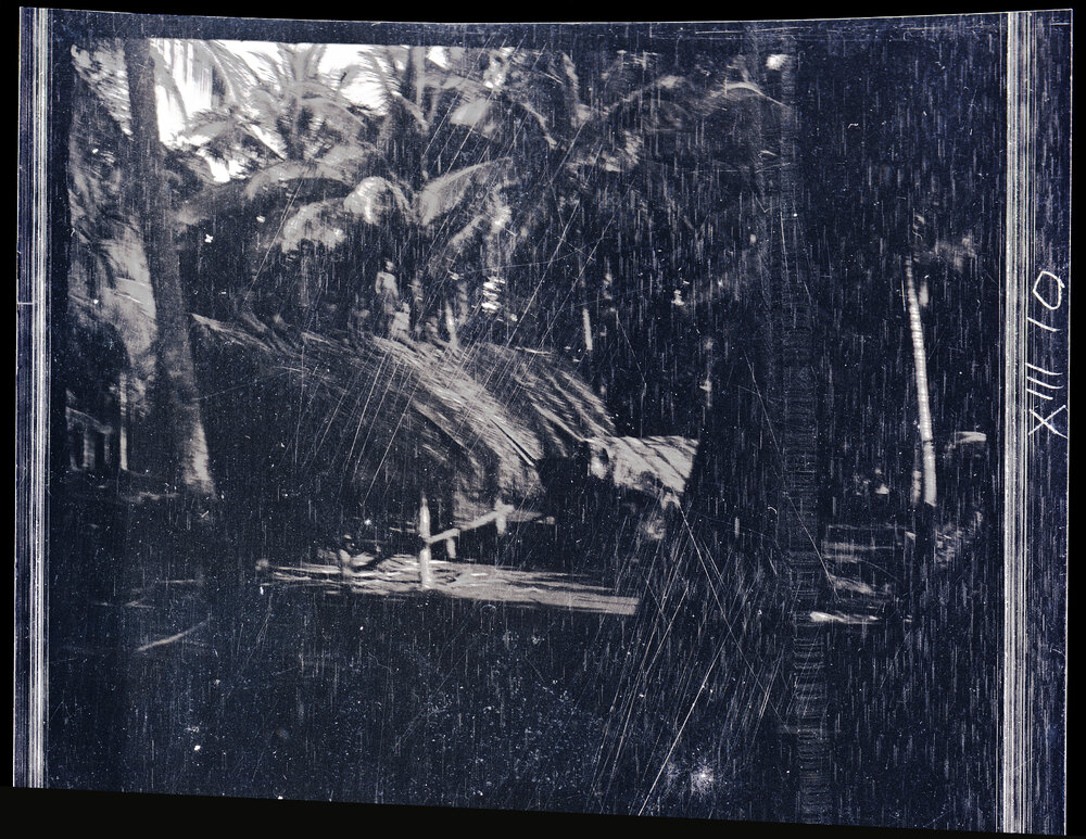 [Manum Island, New Guinea] The Thatching Finished; The Men Stand up to be Photographed