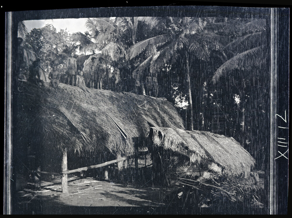 [Manum Island, New Guinea] The Thatching Finished; The Men Stand up to be Photographed