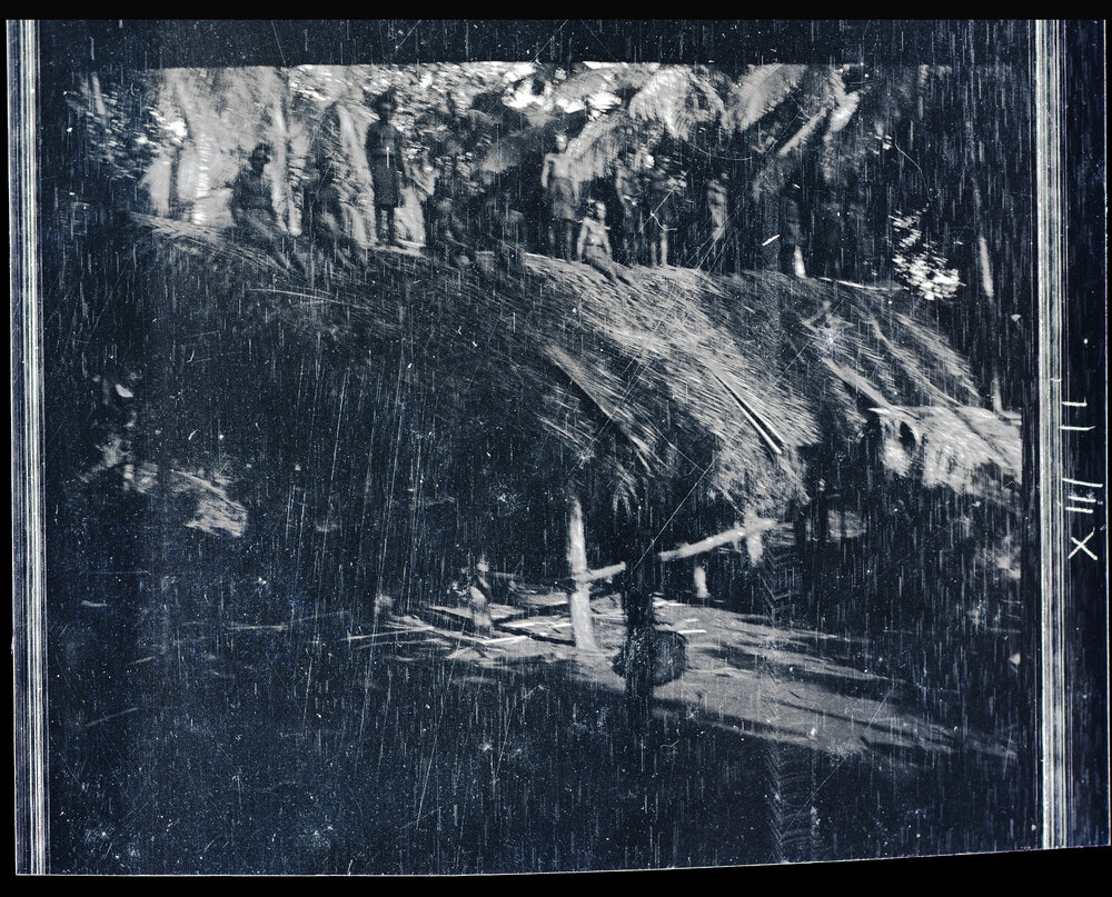 [Manum Island, New Guinea] The Thatching Finished; The Men Stand up to be Photographed
