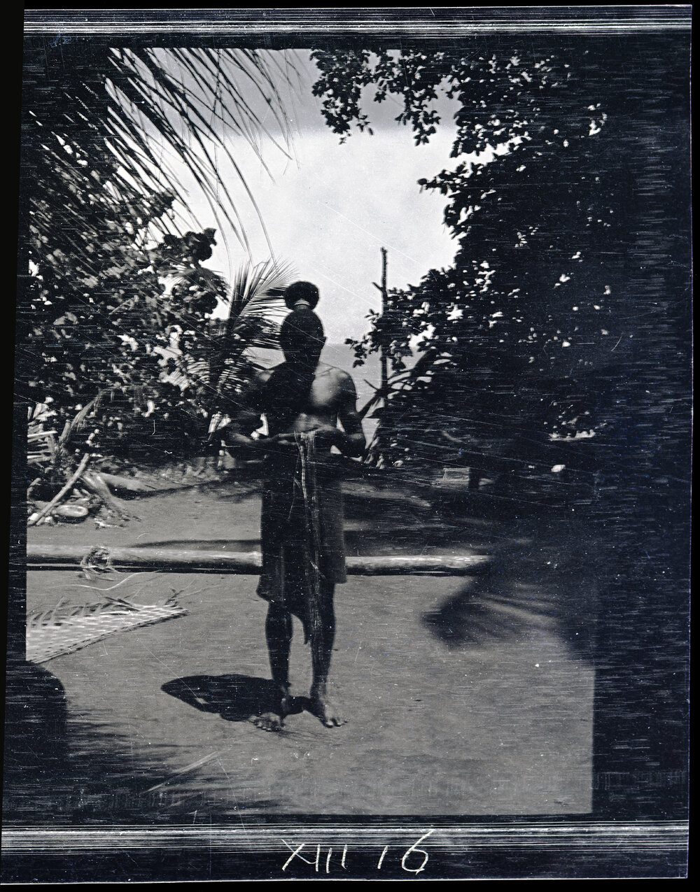 [Manum Island, New Guinea] Zabe Working an Anklet, Strolls up for a Chat
