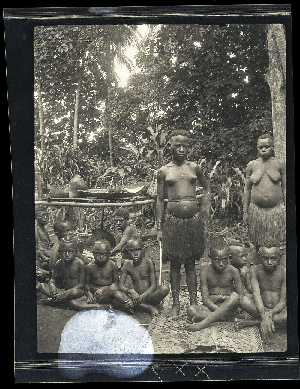 [Manum Island, New Guinea] This Same Girl and her Maids in Waiting Wearing their Ornamental Anklets just Before Being Painted