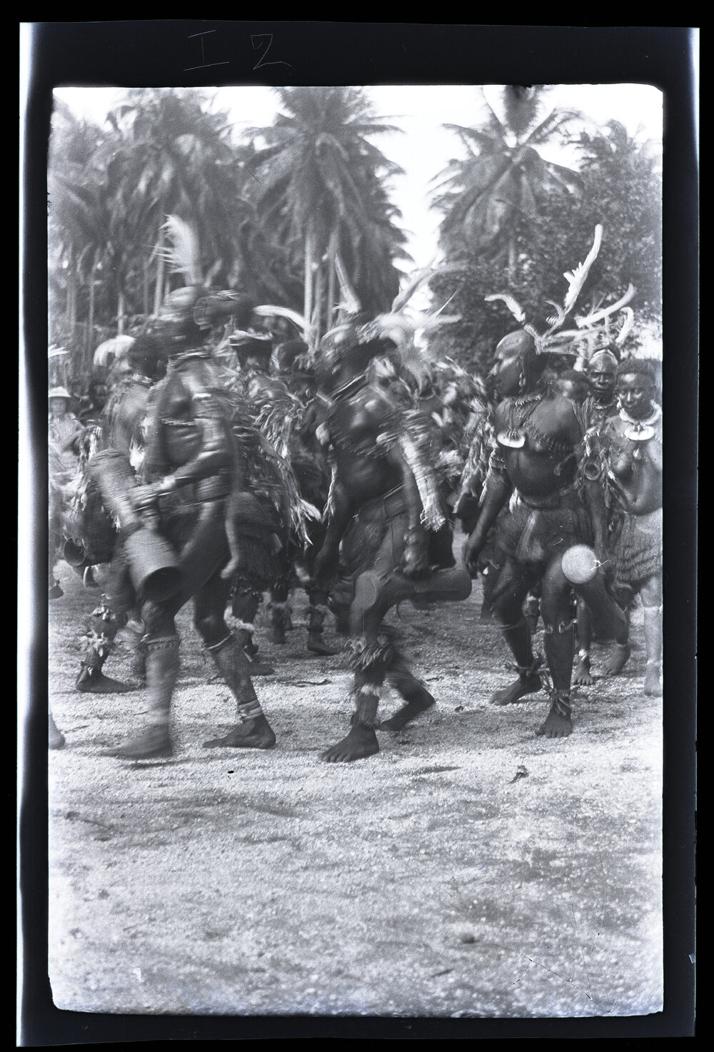 [Manum Island, New Guinea] The Men of Kayan Dance in a Ring