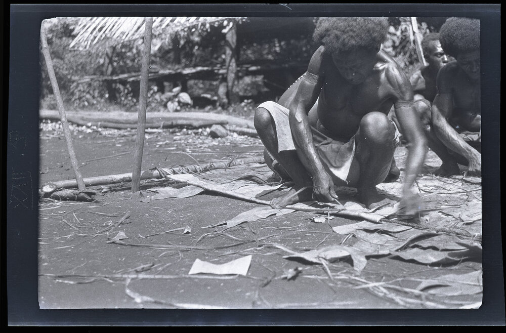 [Manum Island, New Guinea] A Near View of the way in which the Edge of the Sail is Finished off. This Man is Using a European Packing Needle