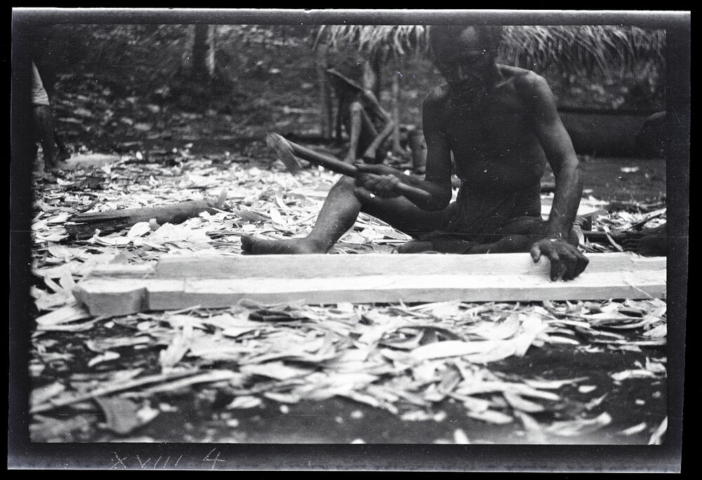 [Manum Island, New Guinea] Arorŋabia Preparing a Plank for the Perapera of MBs [Mamboti] Canoe