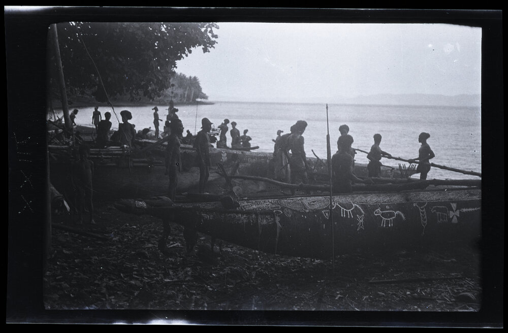 [Manum Island, New Guinea] Men Adjusting the iadzo on Yabururu&rsquo;s Canoe