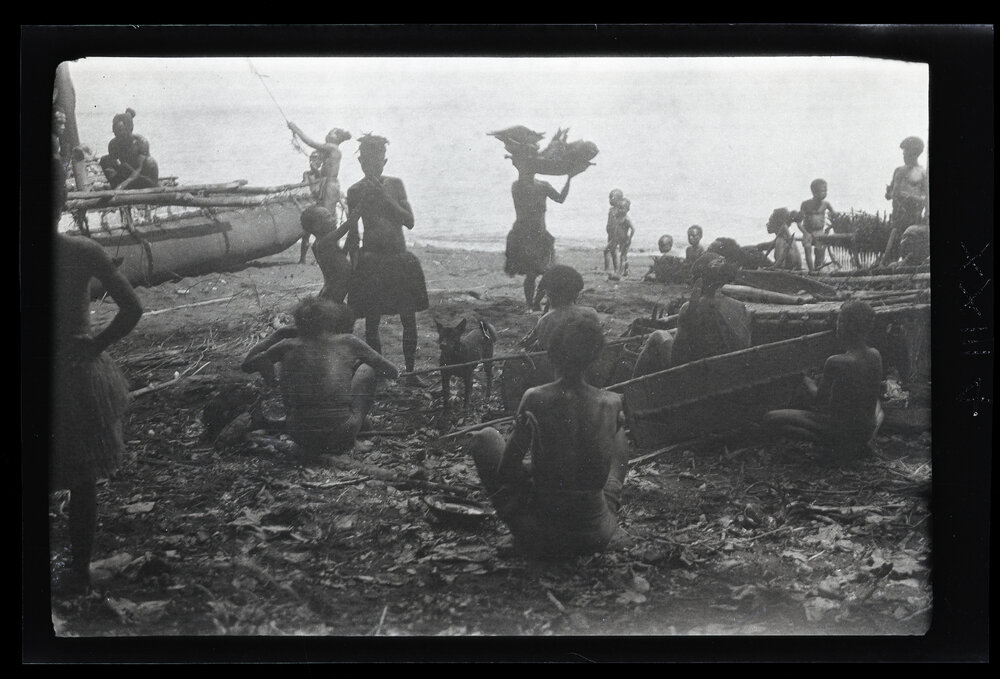 [Manum Island, New Guinea] Mamboti&rsquo;s Canoe. Women Bringing Food for the Workers on the Beach
