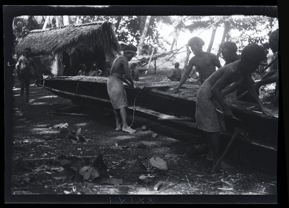 [Manum Island, New Guinea] Mamboti&rsquo;s Canoe. Caulking the Joins Between the Washstrakes and Hull