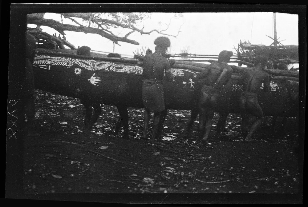 [Manum Island, New Guinea] The Men Carrying the Hull of the Waia Canoe Down to Dabwa Beach where it is to be Finally put Together