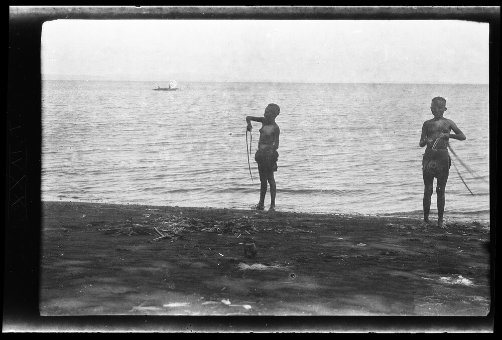 [Manum Island, New Guinea] Tou and Roro Scraping A'u Fibre