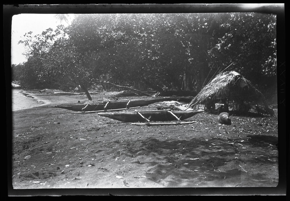 [Manum Island, New Guinea] The Canoe House of Mamboti with some Fishing Canoes Drawn up near by