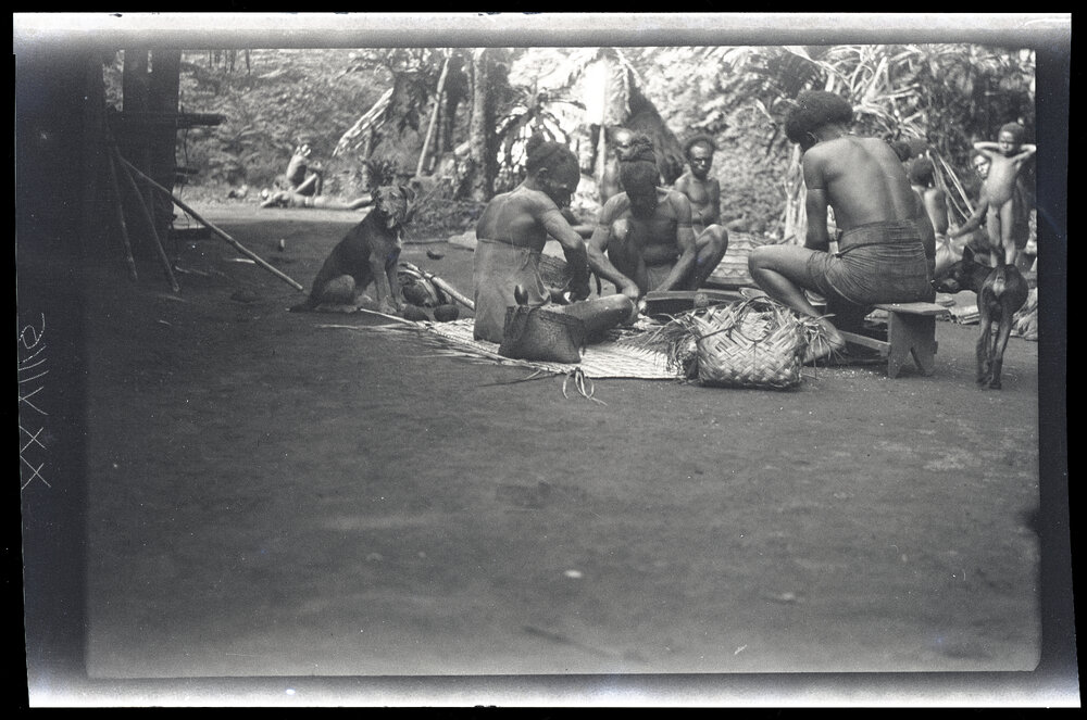 [Manum Island, New Guinea] Aimoŋ and Others Scraping Coconuts