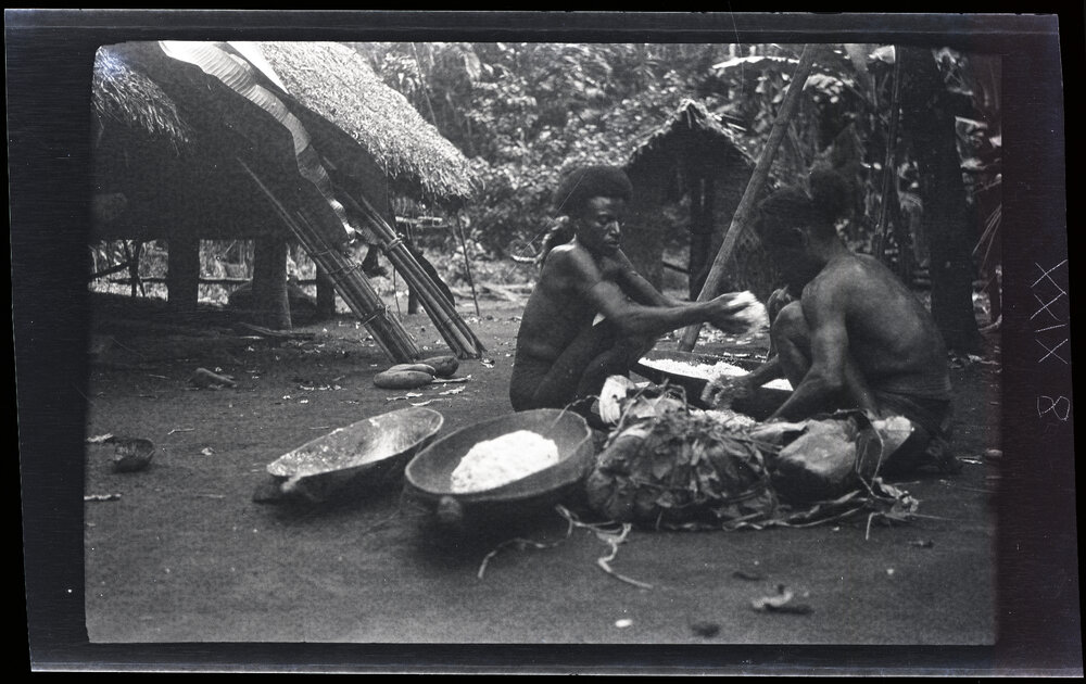 [Manum Island, New Guinea] Two Men Mixing the Sago and Grated Coconut