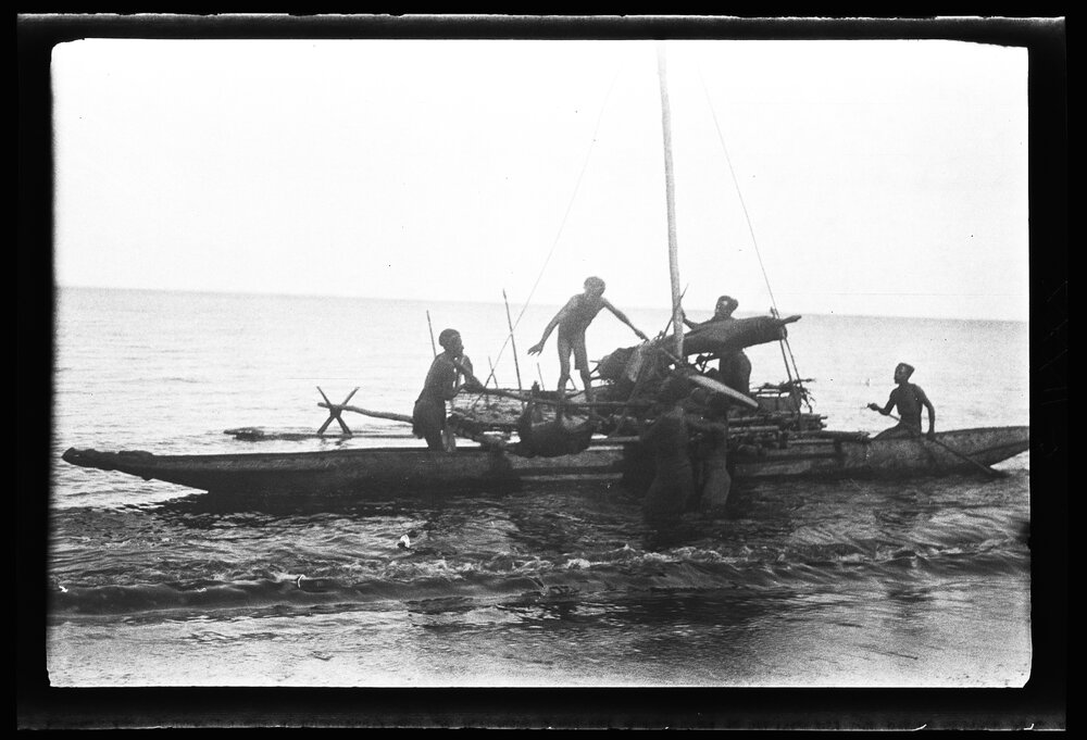 [Manum Island, New Guinea] Transferring a Pig to the Second Buonaputa Canoe which is Already Launched