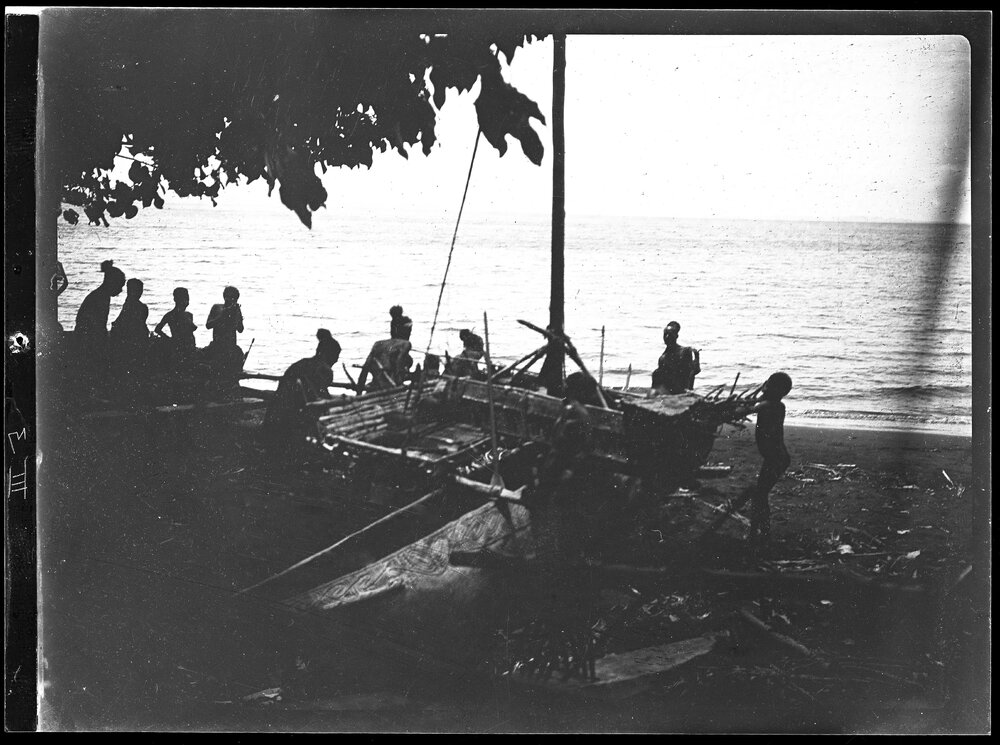 [Manum Island, New Guinea] Beginning to Haul the Canoe Down to the Waters Edge