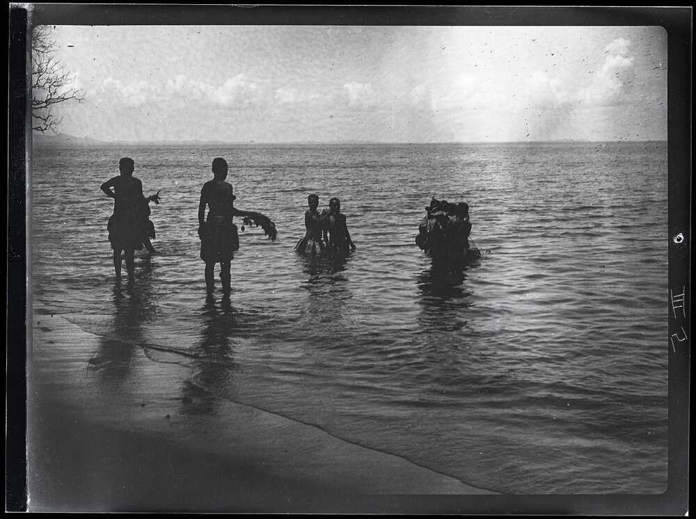 [Manum Island, New Guinea] Mourners Washing Themselves After an Interment