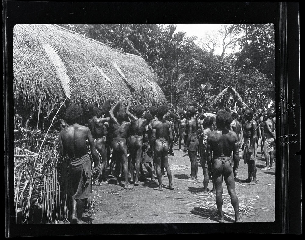 [Manum Island, New Guinea] Removing the Food