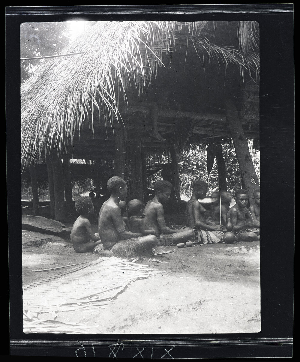 [Manum Island, New Guinea] lanai and her Maids-in-waiting. A Woman Cutting Orna&shy;mental Scars on her