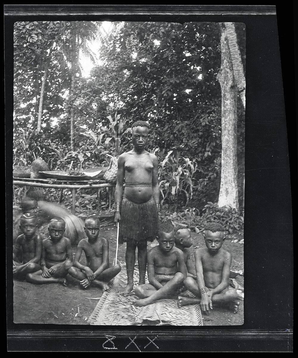 [Manum Island, New Guinea] This Same Girl and her Maids in Waiting Wearing their Ornamental Anklets just Before Being Painted