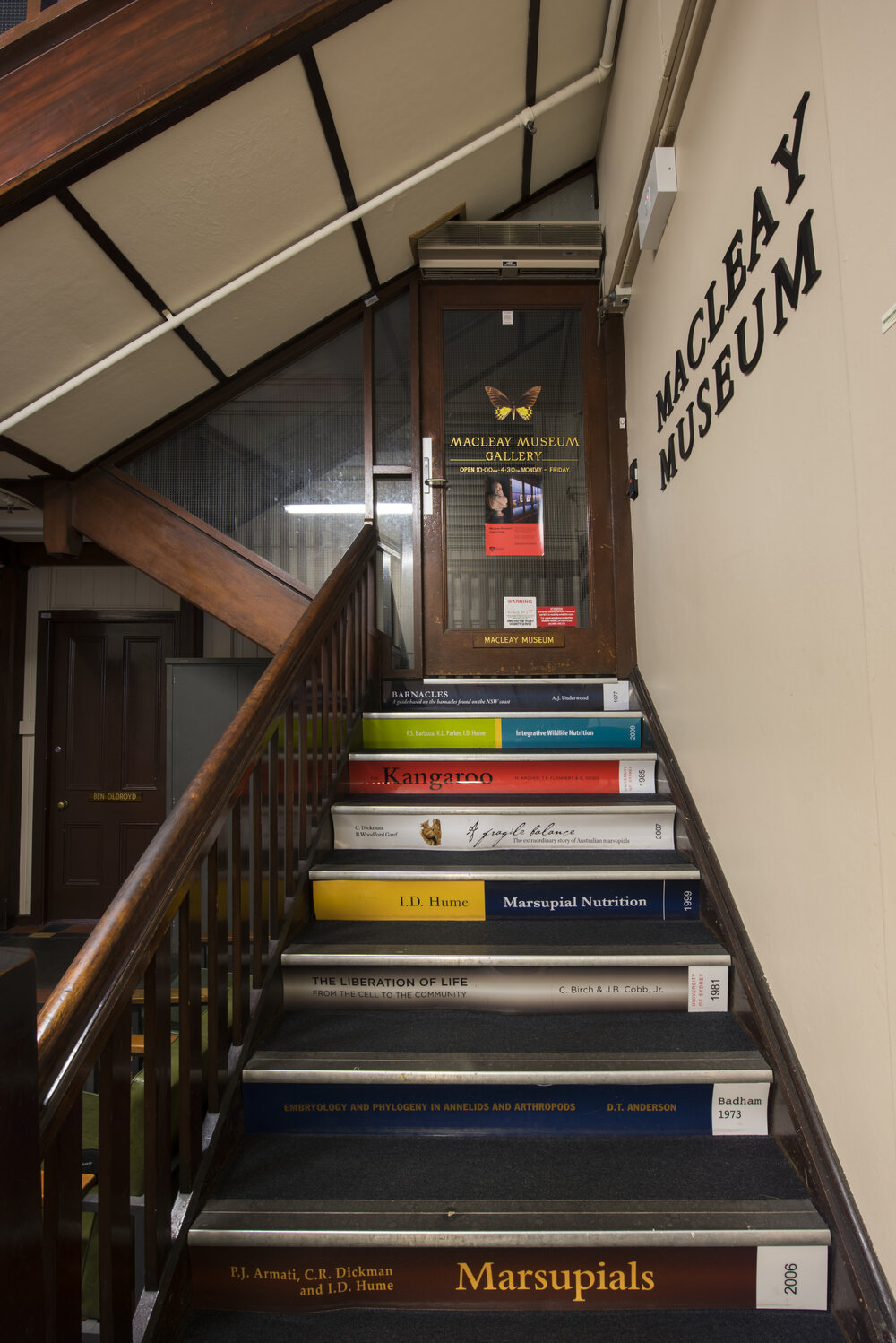 Stairs and Sign on Door to Macleay Museum Gallery