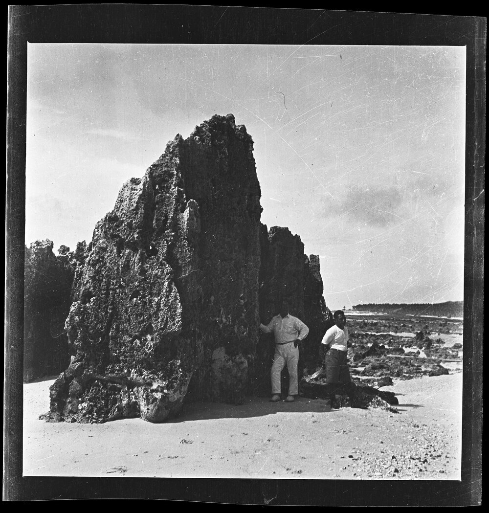 [Narau] Detudamo and Denea Beside One of the Large Stones on the Beach at the North End of Anibari Bay