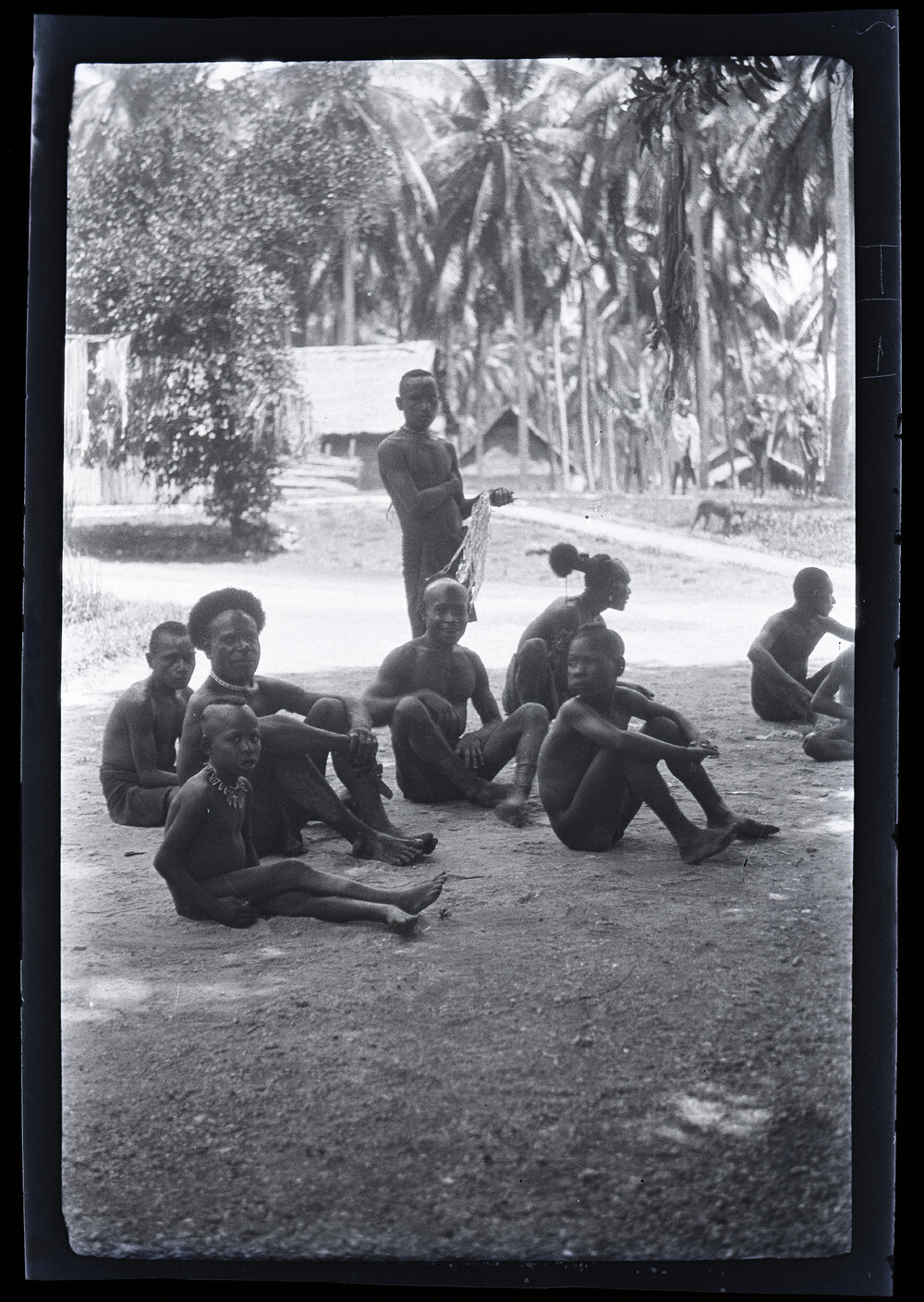 [Manum Island, New Guinea] Men of (?) Nubia Watching the Dancing at Awar Plant[atio]n