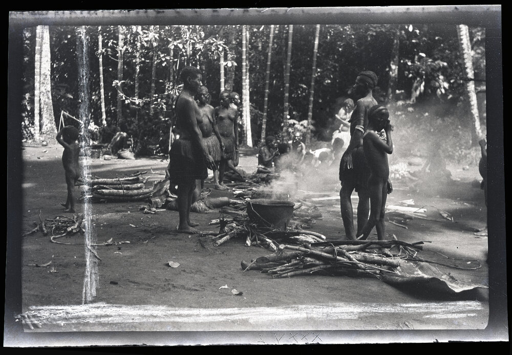 [Manum Island, New Guinea] Watching the Pig Cook