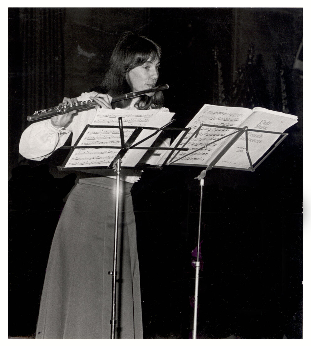 Frances Ford Playing the Flute in the Great Hall at the Annual Function of Convocation