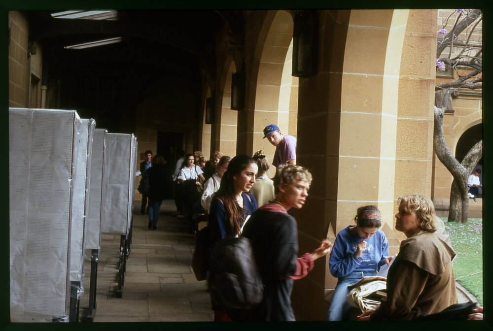 Students in Cloisters with Examination Results